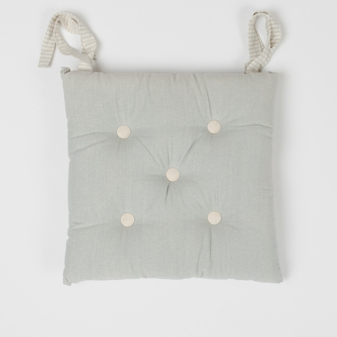 CUSCINO IN COTONE TINTA UNITA CON BOTTONI 0031